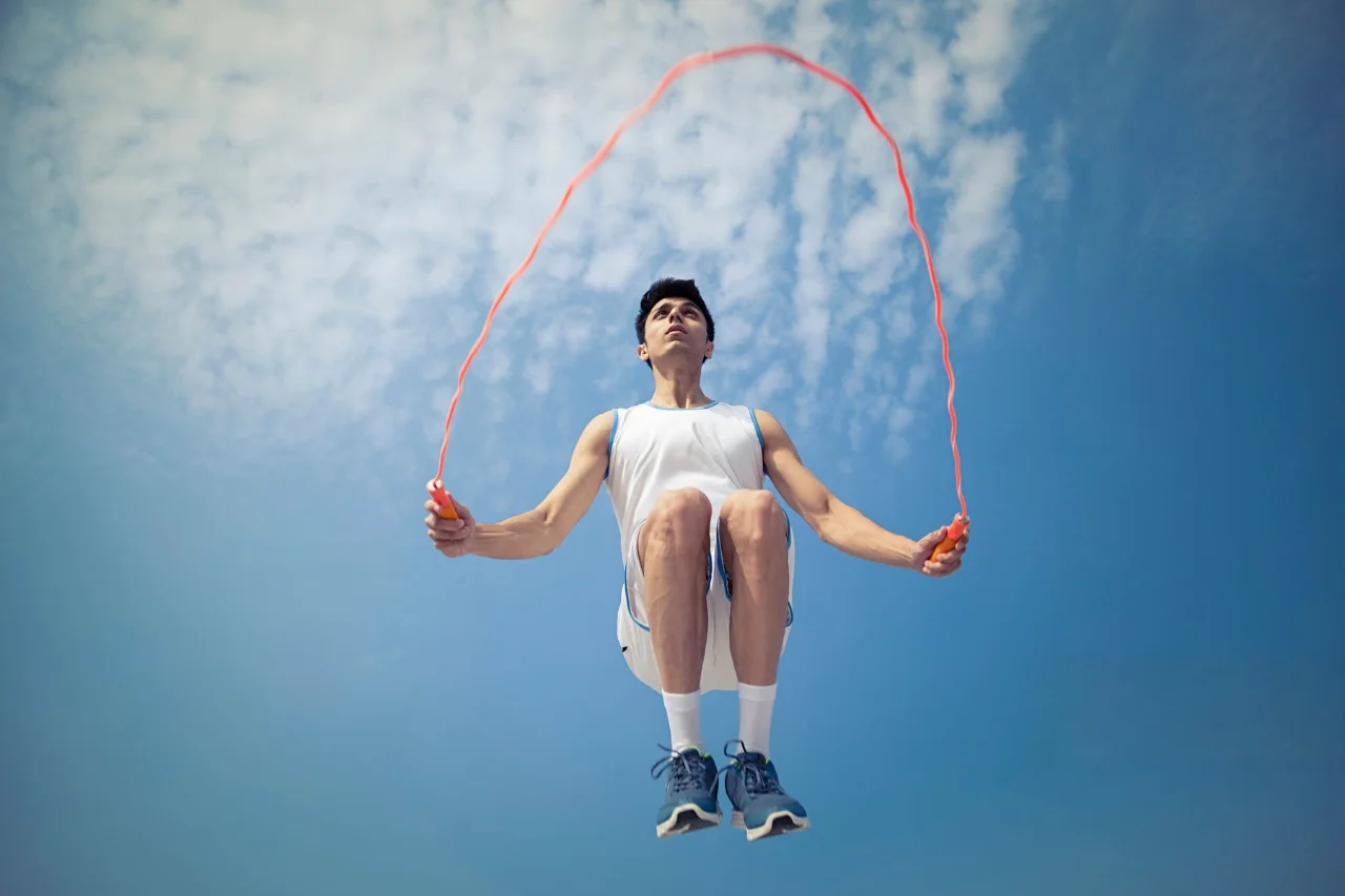 image of man doing jump rope